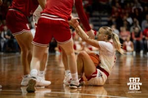 Nebraska Cornhusker guard Alberte Rimdal (5) gets some help up against the South Dakota Coyotes during a college women's basketball game Saturday, November 16, 2024 in Sioux Falls, South Dakota. Photo by Collin Stilen.