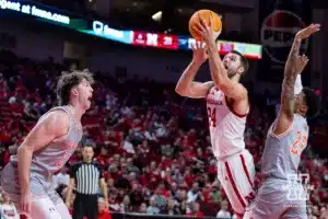 Nebraska Cornhusker guard Rollie Worster (24) makes a lay up against UT Rio Grande Valley Vaqueros forward Marshal Destremau (21) and guard Trey Miller (25) in the first half during a college baskteball game Monday, November 4, 2024, in Lincoln, Nebraska. Photo by John S. Peterson.