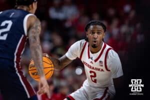 Nebraska Cornhusker guard Ahron Ulis (2) dribbles the ball against Fairleigh Dickinson Knight guard Terrence Brown (2) in the first half during a college basketball game Wednesday, November 13, 2024, in Lincoln, Nebraska. Photo by John S. Peterson.