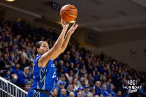 Creighton Bluejay guard Jayme Horan (12) makes a three-point shot against the Nebraska Cornhuskers in the first half during a women’s college basketball game Friday, November 22, 2024 in Omaha, Nebraska. Photo by John S. Peterson.