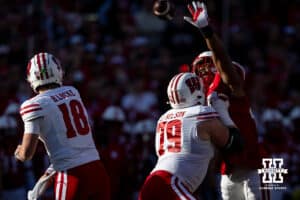 Nebraska Cornhusker linebacker MJ Sherman (48) tries to block a pass against Wisconsin Badger quarterback Braedyn Locke (18) during a college football game Saturday, November 23, 2024 in Lincoln, Nebraska. Photo by John S. Peterson.