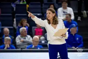 Creighton Bluejays head coach Kirsten Bernthal Booth giving instruction against the St. John's Red Storm in the first set during a college volleyball match Friday, November 1, 2024, in Omaha, Nebraska. Photo by John S. Peterson.