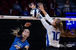 Pierce's Claudia Riggert (2) spikes the ball against Wahoo's Gretchen Seagren (10) during the semi-finals of the 2024 NSAA Volleyball Championships Friday, November 8, 2024, in Lincoln, Nebraska. Photo by John S. Peterson.