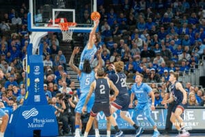 Mason Miller rebounds a ball during a college basketball game November 10th, 2024 in Omaha Nebraska. Photo by Brandon Tiedemann.