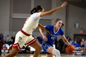 Creighton Bluejay guard Lauren Jensen (15) dribbles the ball against Nebraska Cornhusker guard Amiah Hargrove (33) in the first half during a women’s college basketball game Friday, November 22, 2024 in Omaha, Nebraska. Photo by John S. Peterson.