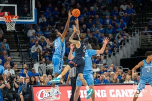 Jamiya Neal contests a shot during a college basketball game November 10th, 2024 in Omaha Nebraska. Photo by Brandon Tiedemann.