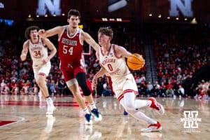 Nebraska Cornhuskers guard Connor Essegian (0) dribbles to the basket for a layup against South Dakota Coyotes center Cameron Fens (54) in the first half during a college basketball game Wednesday, November 27, 2024, in Lincoln, Nebraska. Photo by John S. Peterson.