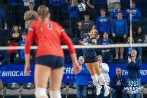 Creighton Bluejay libreo Maddy Bilinovic (22) serves the ball against the St. John's Red Storm in the third set during a college volleyball match Friday, November 1, 2024 in Omaha Nebraska. Photo by Brandon Tiedemann.