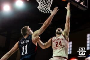 Nebraska Cornhusker guard Rollie Worster (24) makes a layup agaisnt St. Mary's Gaels center Mitchell Saxen (11) during a college basketball game Sunday, November 17, 2024 in Sioux Falls, South Dakota.