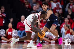 Nebraska Cornhusker forward Juwan Gary (4) dribbles the ball against Fairleigh Dickinson Knight forward Jo'el Emanuel (13) in the second half during a college basketball game Wednesday, November 13, 2024, in Lincoln, Nebraska. Photo by John S. Peterson.