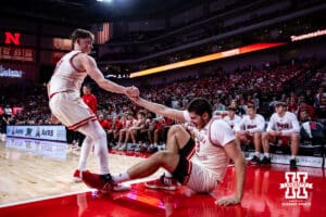 Nebraska Cornhuskers forward Berke Buyuktuncel (9) gets a little help up from guard Connor Essegian (0) against the South Dakota Coyotes in the first half during a college basketball game Wednesday, November 27, 2024, in Lincoln, Nebraska. Photo by John S. Peterson.