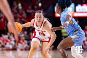 Nebraska Cornhusker guard Callin Hake (14) dribbles the ball against Southern Lady Jaguar guard DaKiyah Sanders (4) in the second half during a college basketball game Tuesday, November 12, 2024, in Lincoln, Nebraska. Photo by John S. Peterson.