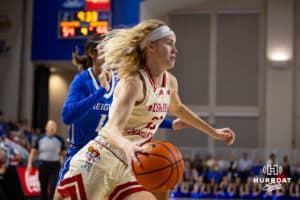 Nebraska Cornhusker guard Britt Prince (23) drives to the basket against Creighton Bluejay guard Kiani Lockett (11) in the second half during a women’s college basketball game Friday, November 22, 2024 in Omaha, Nebraska. Photo by John S. Peterson.