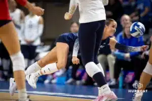 Creighton Bluejay libreo Maddy Bilinovic (22) digs the ball against the St. John's Red Storm in the third set during a college volleyball match Friday, November 1, 2024, in Omaha, Nebraska. Photo by John S. Peterson.