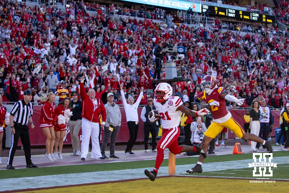 Nebraska Cornhusker running back Emmett Johnson (21) scores a touchdown in the second quarter against USC Trojan cornerback Jaylin Smith (2) during a college football game Saturday, November 16, 2024 in Los Angeles, California. Photo by John S. Peterson.