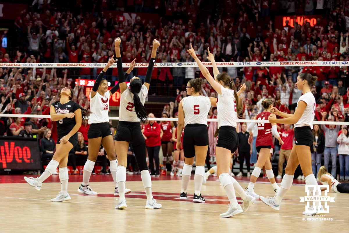 Nebraska Cornhuskers celebrate the win over the Wisconsin Badgers in three sets during a college volleyball match Saturday, November 23, 2024 in Lincoln, Nebraska. Photo by John S. Peterson.