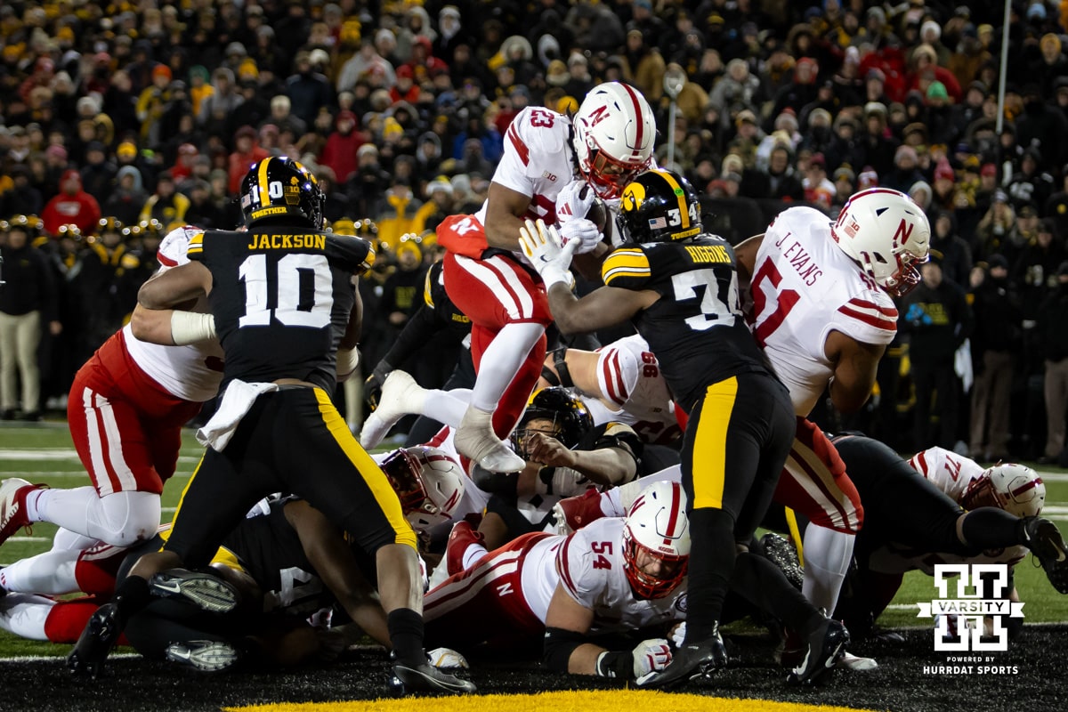 Nebraska Cornhuskers running back Dante Dowdell (23) jumps over for a touch down against the Iowa Hawkeyes in the second quarter during a college football game Friday, November 29, 2024, in Iowa City, Iowa. Photo by John S. Peterson.