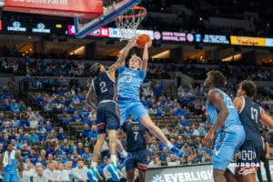 Jackson McAndrew attempts a layup during a college basketball game November 10th, 2024 in Omaha Nebraska. Photo by Brandon Tiedemann.