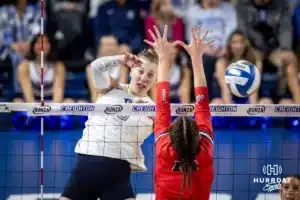 Creighton Bluejay defensive specialist Morgan Colangelo (13) spikes the ball against the St. John's Red Storm in the third set during a college volleyball match Friday, November 1, 2024, in Omaha, Nebraska. Photo by John S. Peterson.