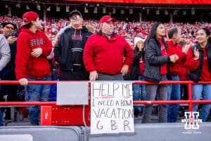 Nebraska Cornhusker fan with a sign hoping for a win for a bowl game during a college football game against the Wisconsin Badgers Saturday, November 23, 2024 in Lincoln, Nebraska. Photo by John S. Peterson.