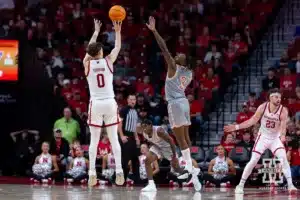 Nebraska Cornhusker guard Connor Essegian (0) makes a three point shot againt UT Rio Grande Valley Vaqueros guard DK Thorn (3) in the second half during a college baskteball game Monday, November 4, 2024, in Lincoln, Nebraska. Photo by John S. Peterson.