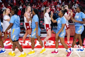 Nebraska Cornhuskers give high fives to Southern Lady Jaguars after a college basketball game Tuesday, November 12, 2024, in Lincoln, Nebraska. Photo by John S. Peterson.