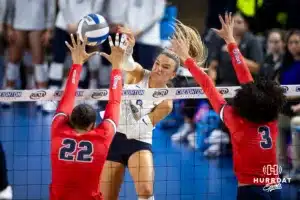 Creighton Bluejay outside hitter Ava Martin (8) spikes the ball against the St. John's Red Storm in the third set during a college volleyball match Friday, November 1, 2024, in Omaha, Nebraska. Photo by John S. Peterson.