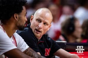 Nebraska Cornhuskers assistant coach Nate Loenser talks to Brice Williams on the bench in the second half against the South Dakota Coyotes during a college basketball game Wednesday, November 27, 2024, in Lincoln, Nebraska. Photo by John S. Peterson.