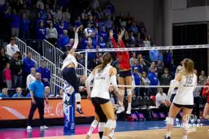 Creighton Bluejay outside hitter Destiny Ndam-Simpson (18) spikes the ball for match point against the St. John's Red Storm in the third set during a college volleyball match Friday, November 1, 2024, in Omaha, Nebraska. Photo by John S. Peterson.