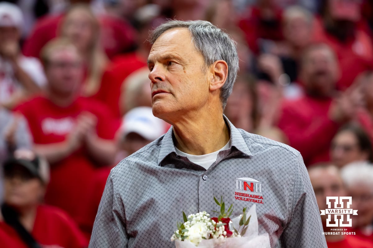 Nebraska Cornhusker head coach John Cook waiting honor the seniors after a college volleyball match Wisconsin Badgers Saturday, November 23, 2024 in Lincoln, Nebraska. Photo by John S. Peterson.