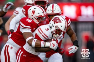 Nebraska Cornhusker defensive lineman Elijah Jeudy (16) tackles Wisconsin Badger running back Tawee Walker (3) in the second quarter during a college football game Saturday, November 23, 2024 in Lincoln, Nebraska. Photo by John S. Peterson.