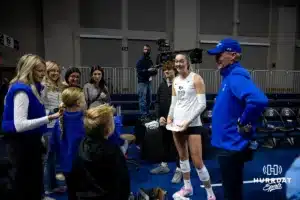 Creighton Bluejay outside hitter Ava TeStrake (12) enjoying talking with some fans after the win against the St. John's Red Storm during a college volleyball match Friday, November 1, 2024, in Omaha, Nebraska. Photo by John S. Peterson.