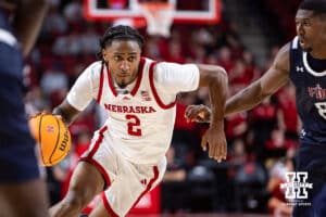 Nebraska Cornhusker guard Ahron Ulis (2) drives to the basket against Fairleigh Dickinson Knight guard Ahmed Barba-Bey (8) in the second half during a college basketball game Wednesday, November 13, 2024, in Lincoln, Nebraska. Photo by John S. Peterson.