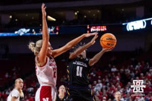 Nebraska Cornhusker forward Natalie Potts (22) blocks a shot from North Alabama Lion guard Veronaye Charlton (11) in the first quarter during a college women’s basektball game Tuesday, November 19, 2024 in Lincoln, Nebraska. Photo by John S. Peterson.