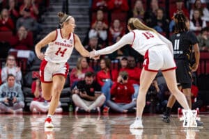 Nebraska Cornhusker guard Kendall Moriarty (15) gives guard Callin Hake (14) five after making a basket against the North Alabama Lionsin the first quarter during a college women’s basektball game Tuesday, November 19, 2024 in Lincoln, Nebraska. Photo by John S. Peterson.