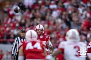 Nebraska Cornhusker quarterback Dylan Raiola (15) makes completes a pass to tight end Luke Lindenmeyer (44) against Wisconsin Badger corner Nyzier Fourqurean (3) in the second quarter during a college football game Saturday, November 23, 2024 in Lincoln, Nebraska. Photo by John S. Peterson.