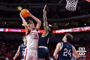 Nebraska Cornhusker forward Henry Burt (35) makes a lay up agasint Fairleigh Dickinson Knight guard Jameel Morris (1) in the second half during a college basketball game Wednesday, November 13, 2024, in Lincoln, Nebraska. Photo by John S. Peterson.