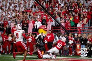 Nebraska Cornhusker wide receiver Isaiah Neyor (18) can't hold on the ball against Wisconsin Badger cornerback Ricardo Hallman (2) in the third quarter during a college football game Saturday, November 23, 2024 in Lincoln, Nebraska. Photo by John S. Peterson.