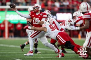 Nebraska Cornhusker quarterback Dylan Raiola (15) throws the ball against Wisconsin Badger defensive lineman Elijah Hills (94) during a college football game Saturday, November 23, 2024 in Lincoln, Nebraska. Photo by John S. Peterson.