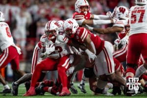 Nebraska Cornhusker linebacker Javin Wright (33) stops Wisconsin Badger running back Darrion Dupree (13) in the fourth quarter during a college football game Saturday, November 23, 2024 in Lincoln, Nebraska. Photo by John S. Peterson.