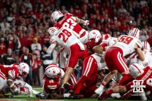 Nebraska Cornhusker running back Dante Dowdell (23) dives over the top for a touchdown against the Wisconsin Badgers in the fourth quarter during a college football game Saturday, November 23, 2024 in Lincoln, Nebraska. Photo by John S. Peterson.