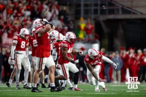 Nebraska Cornhusker defensive lineman Jimari Butler (10) acts like he is bowling to celebrate the win over the Wisconsin Badgers during a college football game Saturday, November 23, 2024 in Lincoln, Nebraska. Photo by John S. Peterson.