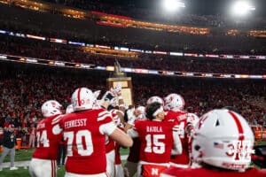 Nebraska Cornhuskers carry off the Freedom Trophy after the win over the Wisconsin Badgers during a college football game Saturday, November 23, 2024 in Lincoln, Nebraska. Photo by John S. Peterson.