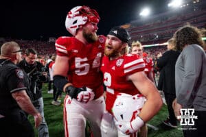 Nebraska Cornhusker offensive lineman Bryce Benhart (54) and defensive back Isaac Gifford (2) celebrate after the win over the Wisconsin Badgers during a college football game Saturday, November 23, 2024 in Lincoln, Nebraska. Photo by John S. Peterson.