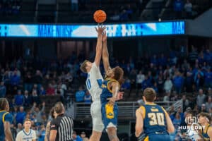 Creighton Bluejay Ryan Kalkbrenner jumps for the ball to start the game against UMKC during a college basketball game Saturday, November 16th, 2024 in Omaha Nebraska. Photo by Brandon Tiedemann.