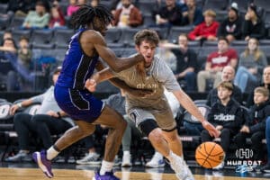 Omaha Mavericks Tony Osburn drives to the hoop during a college basketball game on November 30th, 2024 in Omaha Nebraska. Photo by Brandon Tiedemann.