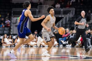 Omaha Mavericks Lance Waddles brings the ball up court during a college basketball game on November 30th, 2024 in Omaha Nebraska. Photo by Brandon Tiedemann.