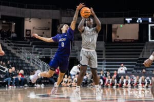 Omaha Mavericks JJ White shoots a three during a college basketball game on November 30th, 2024 in Omaha Nebraska. Photo by Brandon Tiedemann.