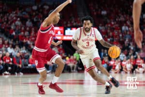 Nebraska Cornhuskers guard Brice Williams (3) drives to the basket against Indiana Hoosiers forward Bryson Tucker (8) in the first half during a college basketball game Friday, December 13, 2024 in Lincoln, Nebraska. Photo by Jaelle Johnson.