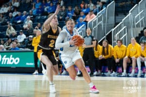 Creighton Bluejays Molly Mogensen drives to the basket during a college basketball game against the Wyoming Cowgirls on December 17th, 2024 in Omaha Nebraska. Photo by Brandon Tiedemann.